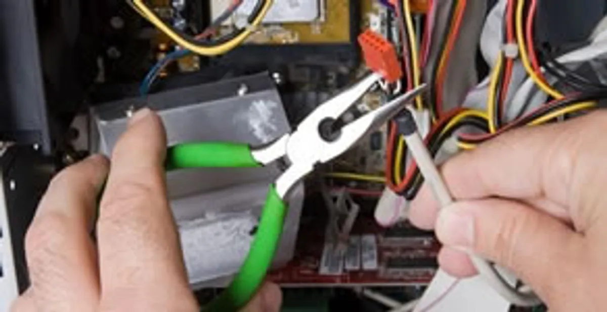 Licensed electrical contractor performing electrical repair with tools in Newport, KY